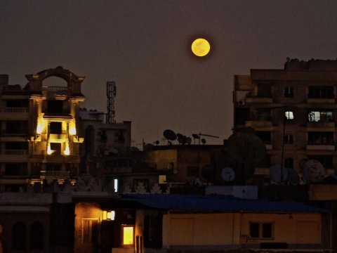 Super-Moon rising over Cairo, Egypt by Jill Stafiej