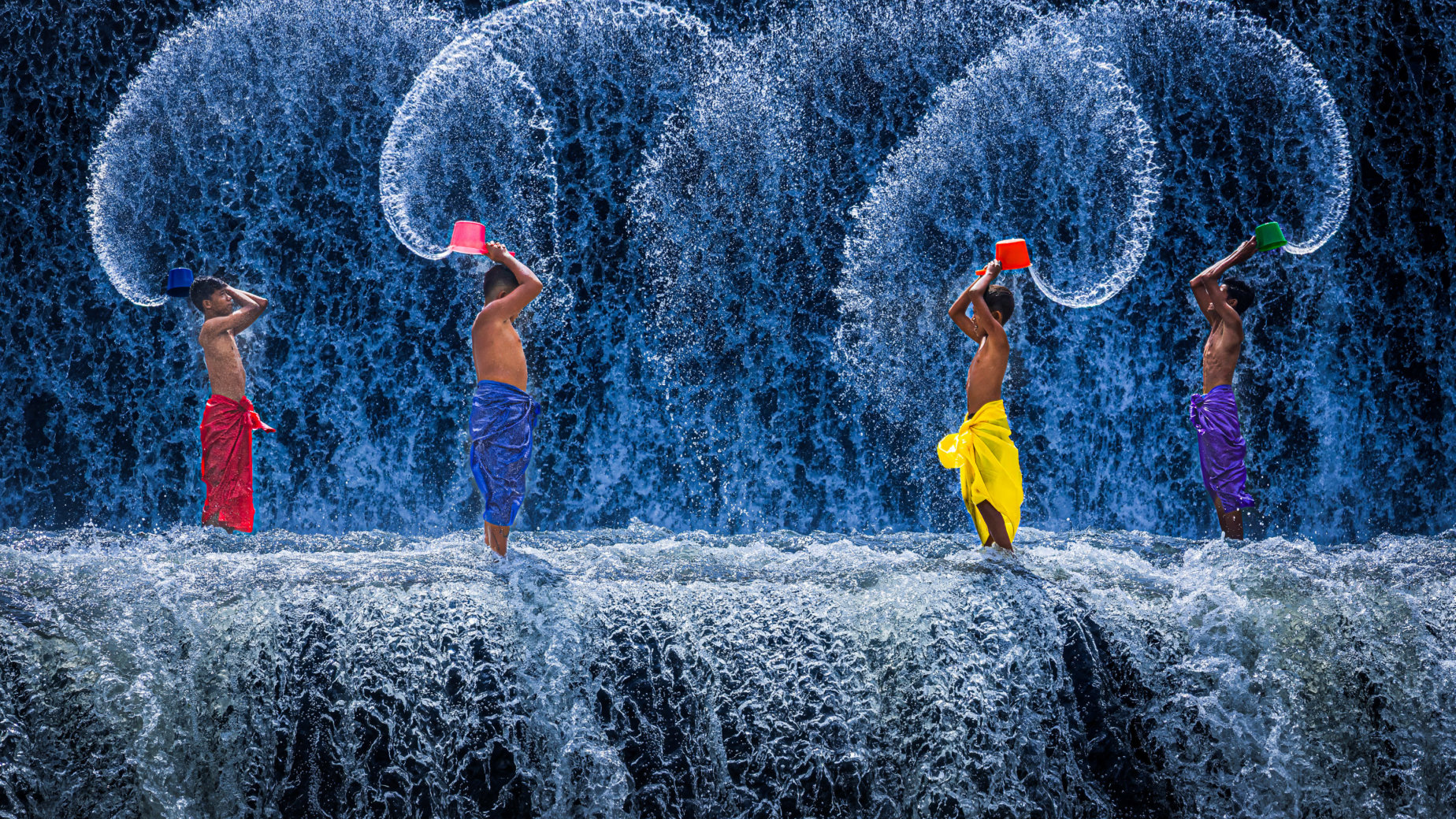 Fun at the Waterfall, Bali by Guy P Larin